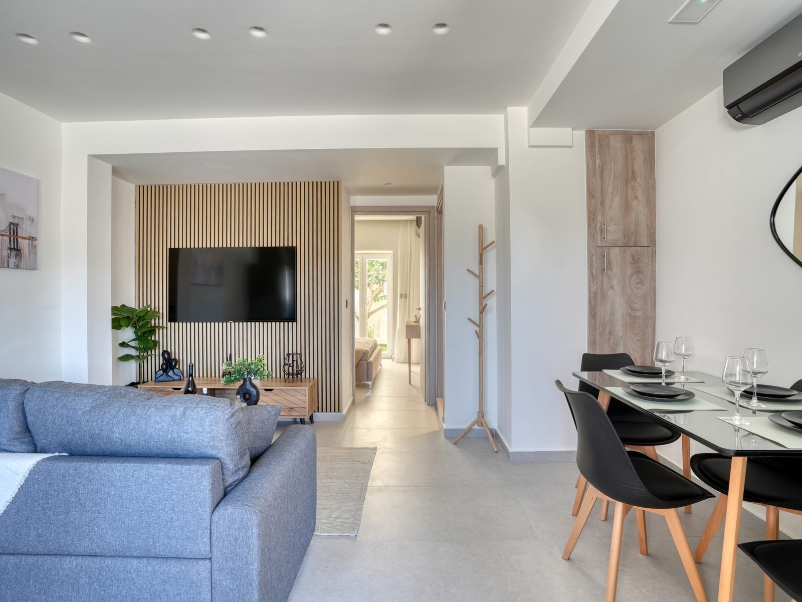 Living and dining area with grey sofa