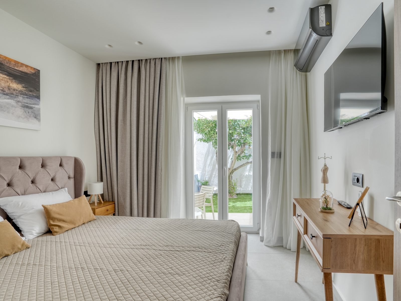 Bedroom with double bed and balcony light